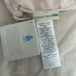 Pottery Barn Kids pink crib skirt